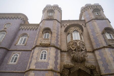 Stunning architecture of the tiled walls of Pena Palace in Sintra, Portugal on a foggy winter dayのeditorial素材