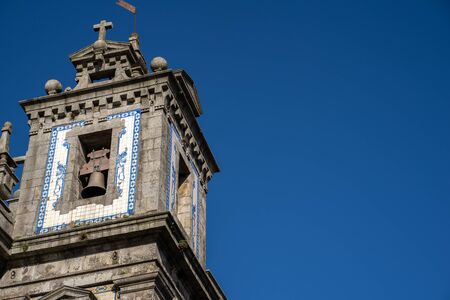 Exterior of the Church of Saint Ildefonso in Porto, Portugal on a sunny day - on the bell towerの写真素材
