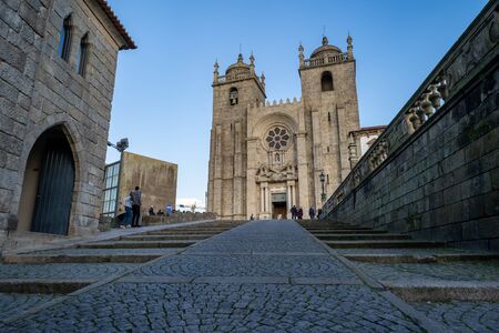 Porto, Portugal - January 20, 2020: Porto Se Cathedral Church as seen from the cobblestone walkway path on a sunny winter dayのeditorial素材