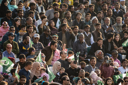 Wagah, Pakistan - Febuary 8, 2020: Pakistani nationals gather in the stadium to watch the Wagah Border Closing ceremony with Indiaのeditorial素材