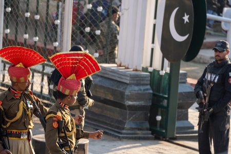 Attari, India - Febuary 8, 2020: Indian Border Security Force members face off against Pakistan Rangers at the Wagah Border ceremonyのeditorial素材