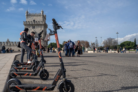 Lisbon, Portugal - January 17, 2020: Circ scooters for rent on a sidewalk in Lisbon near Belem Tower. This is a Berlin-based e-scooter rentals companyのeditorial素材