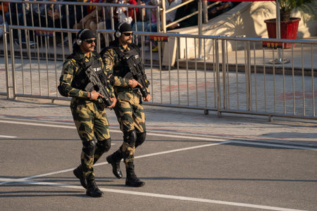 Indian Border Security force members march toward the Wagah, Pakistan border