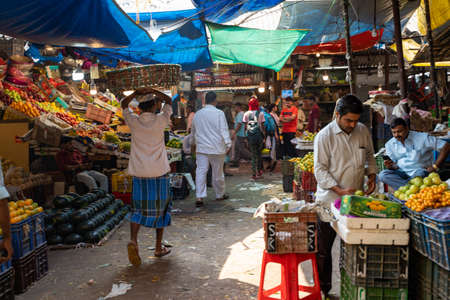 Mumbai, India - February 29, 2020: Vendors selling fruit hard at work in the Crawford Market, known for its fresh fruits and vegetablesのeditorial素材