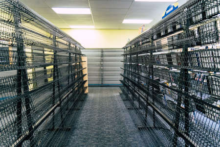 AUGUST 12 2018 - FAIRBANKS, ALASKA: Empty shelves inside of a Blockbuster Video store in its final days of its store closing sale during a liquidationのeditorial素材