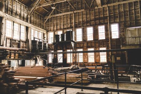 Inside the old steam generated power plant in the Kennecott Mine in McCarthy Alaska, looking through the windows. Wrangell St. Elias National Parkの写真素材