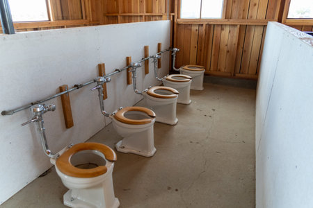 Rows of exposed toliets in the bathrooms at the Manzanar Japanese Internment Camp in Independence...
