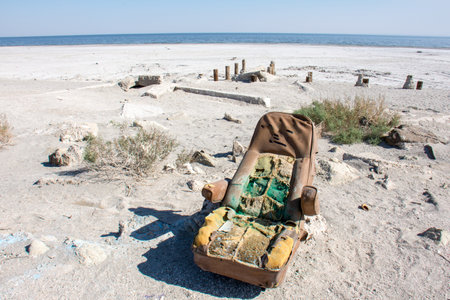 Old abandoned car seat sits on Bombay Beach in the Salton Sea area of Californiaの写真素材