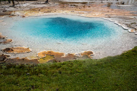 Liberty Spring, a hot spring geothermal pool in the Fountain Paint Pot trail area of Yellowstone National Parkの写真素材