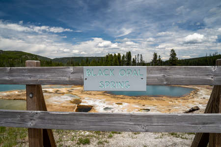 Black Opal spring, located in the Biscuit Basin, a geothermal feature area of Yellowstone National Park - signの写真素材