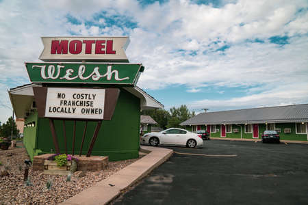 Wall, South Dakota - July 24, 2020: Sign and exterior of the Motel Welsh, a small, locally owned motorcourt style retro motel, near Wall Drug and the Badlandsのeditorial素材