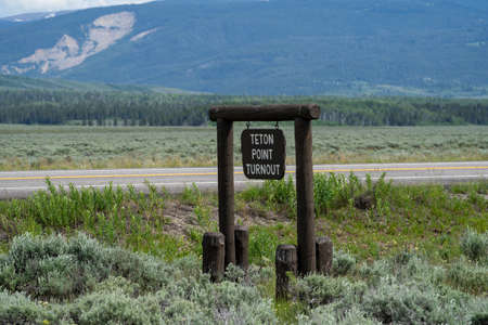 The Grand Teton National Park mountains in Wyoming - the Teton Point turnout signの写真素材