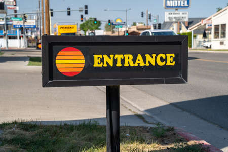 Winnemucca, Nevada - August 5, 2020: Entrance sign for an Economy Inn, a cheap hotel, with a classic retro logoのeditorial素材