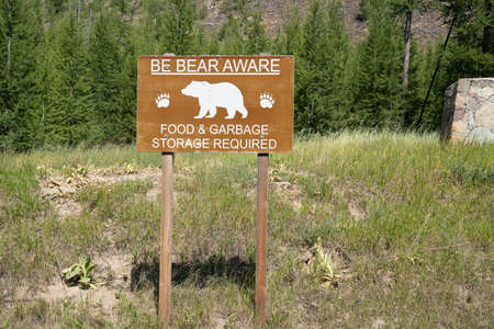 Sign - be bear aware - food and garbage storage required, in grizzly areaの写真素材
