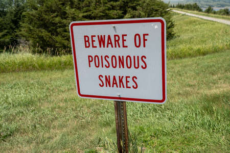 Sign - Beware of Poisonous Snakes, warning hikers of dangerの写真素材