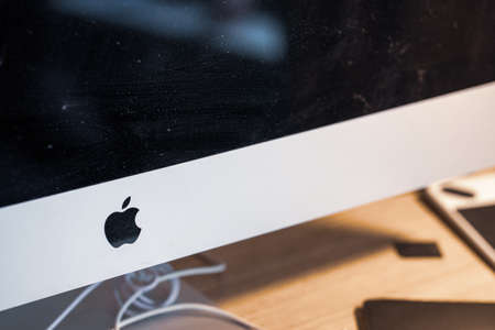 Minnesota, USA - November 15, 2020: Close up of the Apple logo on an iMac desktop computerのeditorial素材