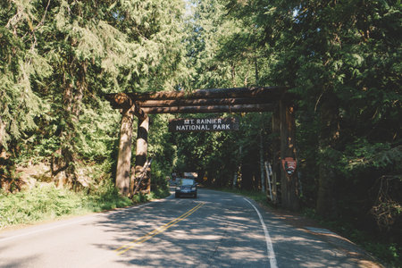 Washington, USA - July 30, 2020: Welcome sign to Mt. Rainier National Park as cars drive throughのeditorial素材