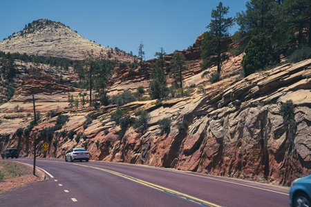 Utah, USA - May 16, 2021: Cars drive along the Zion-Mt. Carmel Scenic Highway in Zion National Parkのeditorial素材