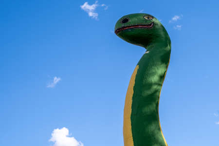 Holbrook, Arizona - May 17, 2021: Fiberglass roadside dinosaurs at the Rainbow Rock Shop along historic Route 66.のeditorial素材