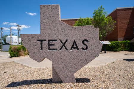 Granite rock monument shaped like the state of Texasの写真素材