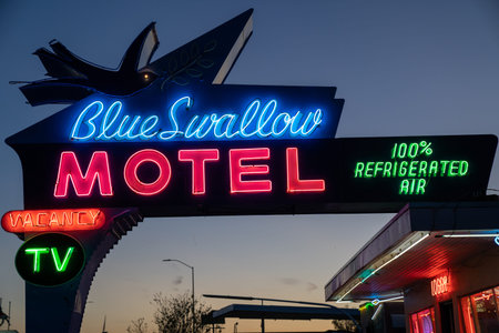 Tucamcari, New Mexico - May 6, 2021: Close up of the Blue Swallow Motel neon sign, a famous classic...