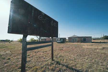 San Jon, New Mexico - May 6, 2021: Old abandoned neon sign, mostly in ruins, along Route 66, with sunflareのeditorial素材