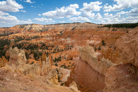 The Queens Garden hiking trail in Bryce Canyon National Park, during an partly cloudy dayの写真素材