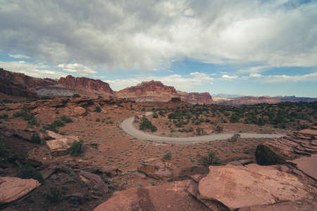 The twisty road leading to the Goosenecks trail in Capitol Reef National Park, as seen from Sunset Pointの写真素材