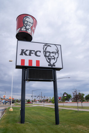 Gillette, Wyoming - June 26, 2021: Sign and spinning bucket for a KFC (Kentucky Fried Chicken) fast...