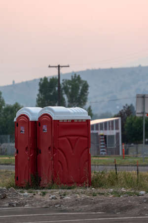 Anaconda, Montana - July 11, 2021: Two portable bathrooms (portapotties) outdoors, at a construction siteのeditorial素材