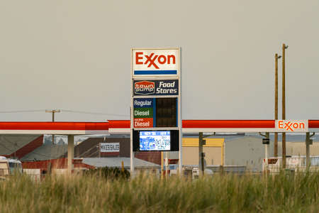 Anaconda, Montana - July 11, 2021: Sign for Exxon Towne Pump Gas Station, taken at dusk and sunsetのeditorial素材