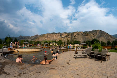 Corwin Springs, Montana - August 25, 2021: Fisheye lens view of the Yellowstone Hot Springs swimming pools, as people soak in the poolsのeditorial素材