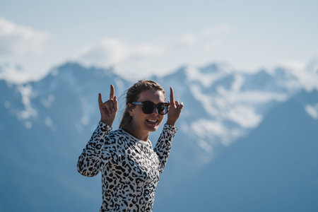 Adult woman shows the peace sign at Hurricane Ridge in National Park