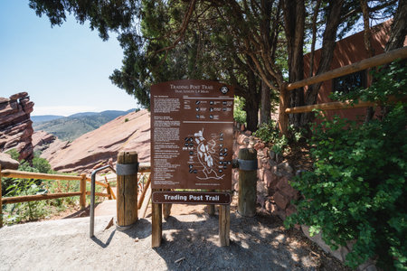 Colorado, USA - July 30, 2021: Trading Post trailhead sign at the Red Rocks Park and amphitheater in...