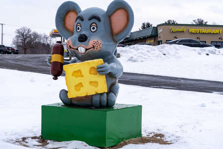 Mautson, Wisconsin - January 16, 2022: The famous Mautson mouse, holding cheese and a hot dog. Taken in winterのeditorial素材