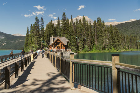 British Columbia, Canada - July 11, 2022: Bridge across Emerald Lake, leading to the lodge and restaurant in summerのeditorial素材