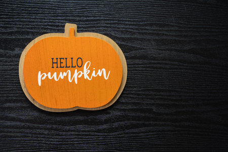 Hello Pumpkin flat lay, top down view, on a black wood backgroundの写真素材
