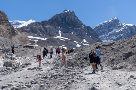 Alberta, Canada - July 12, 2022: Tourists walk up the trail visiting the Toe of the Glacier trail at Athabasca Glacier at the Columbia Icefieldsのeditorial素材