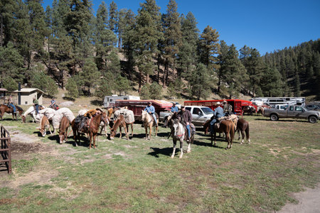 Glenwood, New Mexico - October 21, 2022: Group of men ranchers rope up and pack horses for a hunting trip at campのeditorial素材