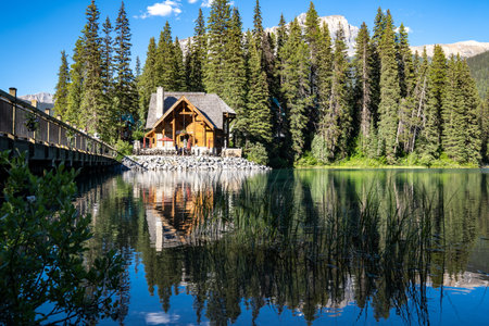 British Columbia, Canada - July 11, 2022: View of the Emerald Lake Lodge restaurant and bridge on a...