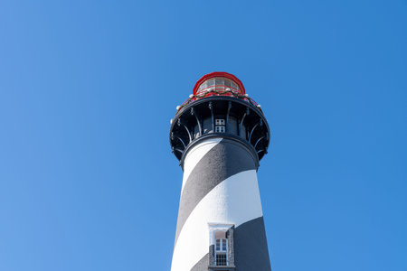 The famous St. Augustine Lighthouse against a bright blue sunny Florida sky