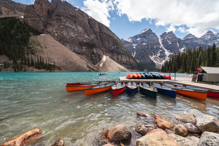 Alberta, Canada - July 9, 2022: Canoes at the boathouse on Morinae Lake in the summer in the Canadian Rockiesのeditorial素材