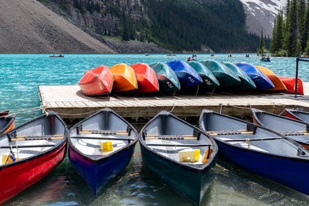 Alberta, Canada - July 9, 2022: Canoes at the boathouse on Morinae Lake in the summer in the Canadian Rockiesのeditorial素材