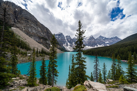 Moraine Lake in Banff National Park on an overcast dayの写真素材