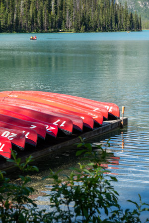 Red canoes at the boathouse on Emerald Lake - Yoho National Parkの写真素材