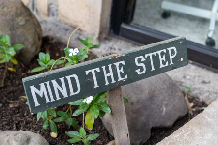 Mind the Step sign to warn people of uneven surfaces aheadの写真素材