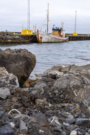 Grindavik, Iceland - June 29, 2023: Old rusty fishing boat ship in the small port in a village on the Reykjanes Peninsulaのeditorial素材