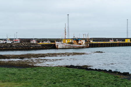 Grindavik, Iceland - June 29, 2023: Old rusty fishing boat ship in the small port in a village on the Reykjanes Peninsulaのeditorial素材