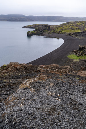 Lake Kleifarvatn on a foggy, overcast summer day in Icelandの写真素材