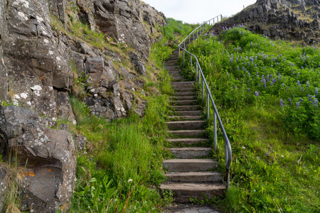 Trail of steps leading up the hill to Sugandisey Island Lighthouse in Stykkisholmur Icelandの写真素材